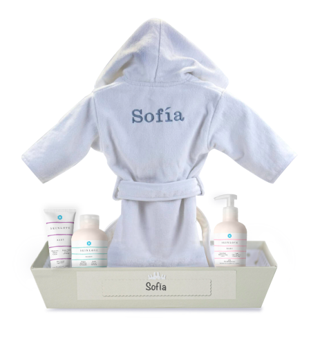 Natural cosmetic products for babies with embroidered bathrobe